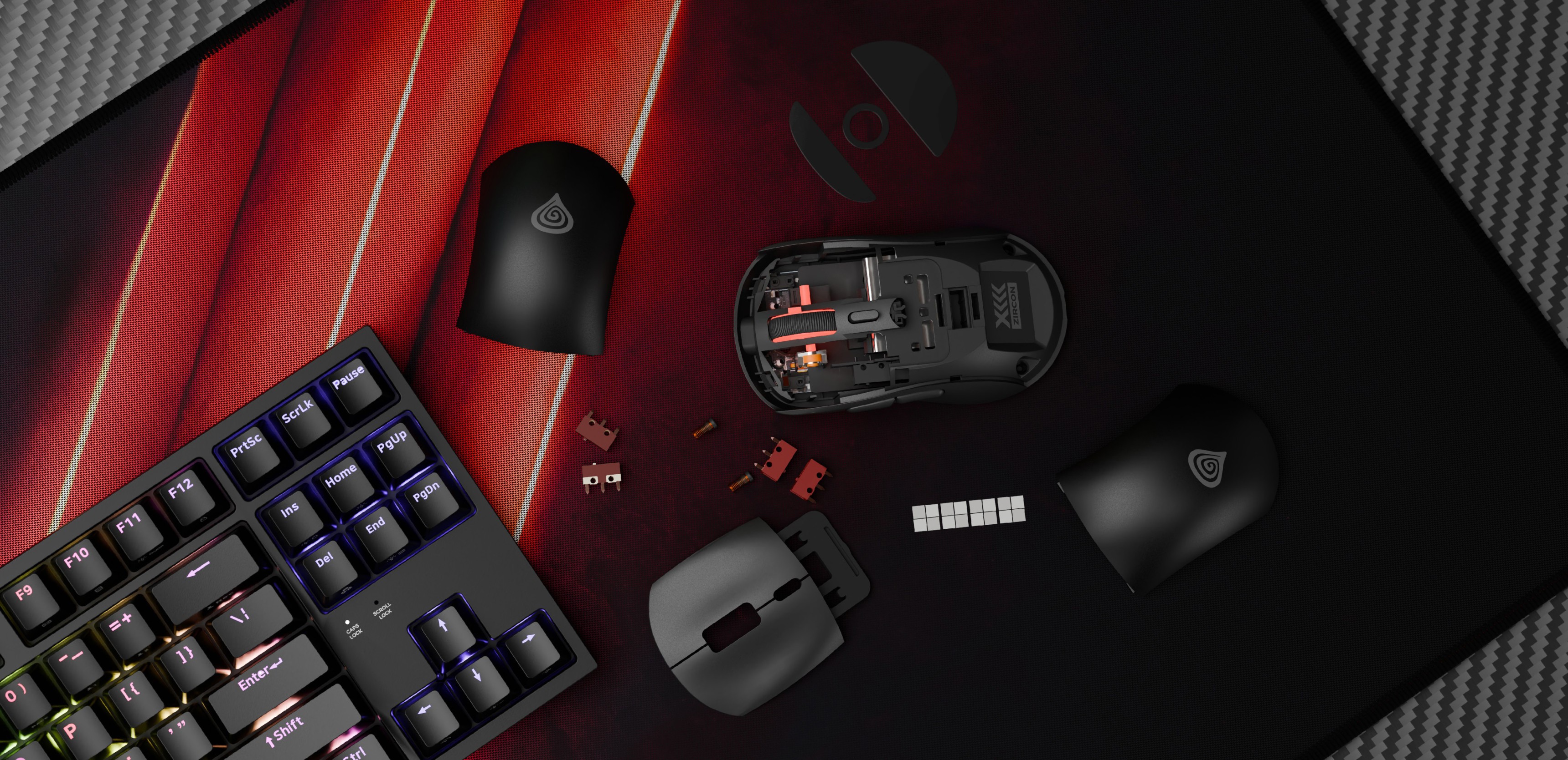 Mouse de gaming fără fir Genesis Zircon XIII în negru, cu capace detașabile și componente pe un mouse pad texturat alături de o tastatură